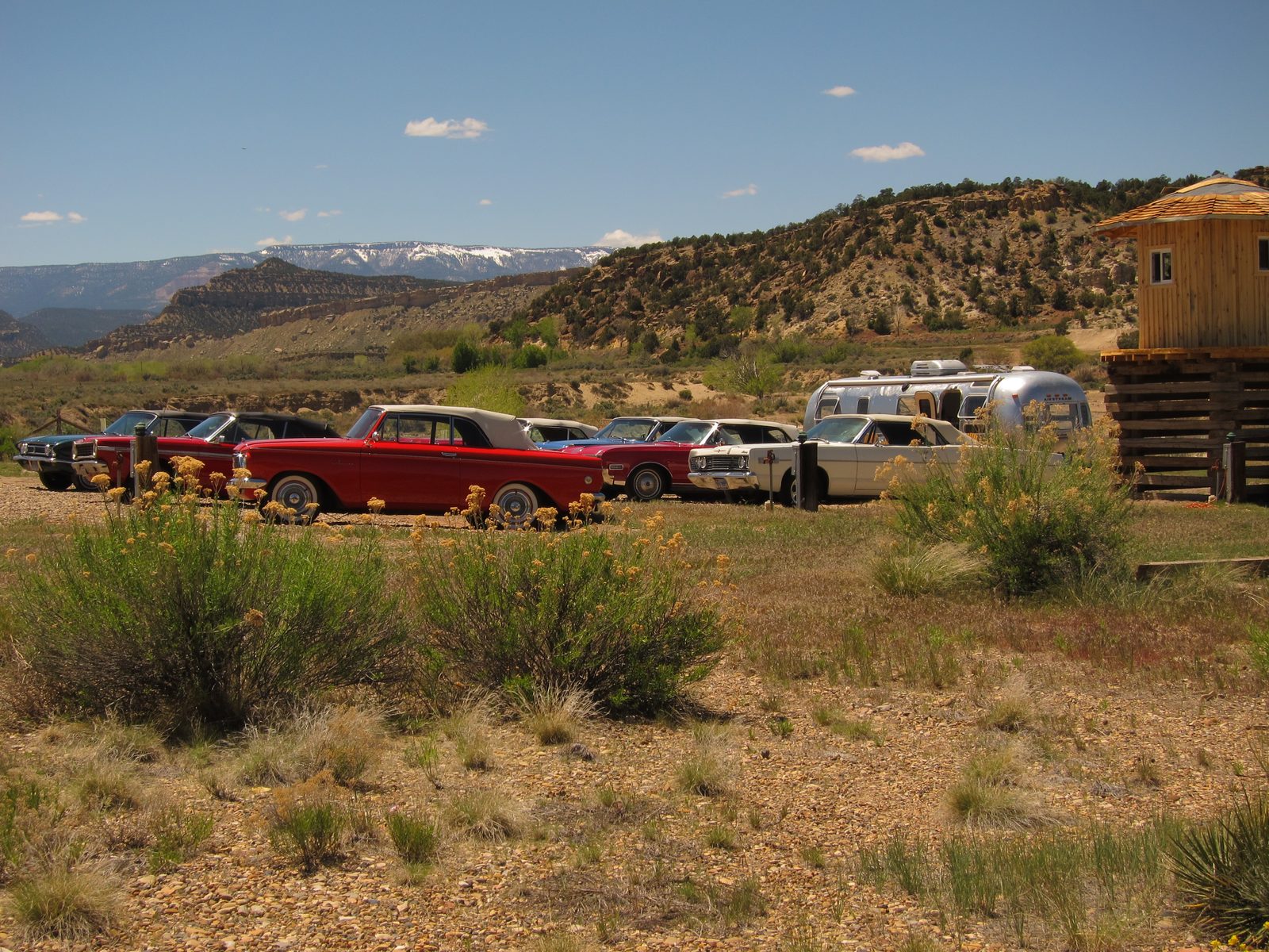 The 1950 era convertibles parked in the lot of the Drive-in Theatre associated with the...